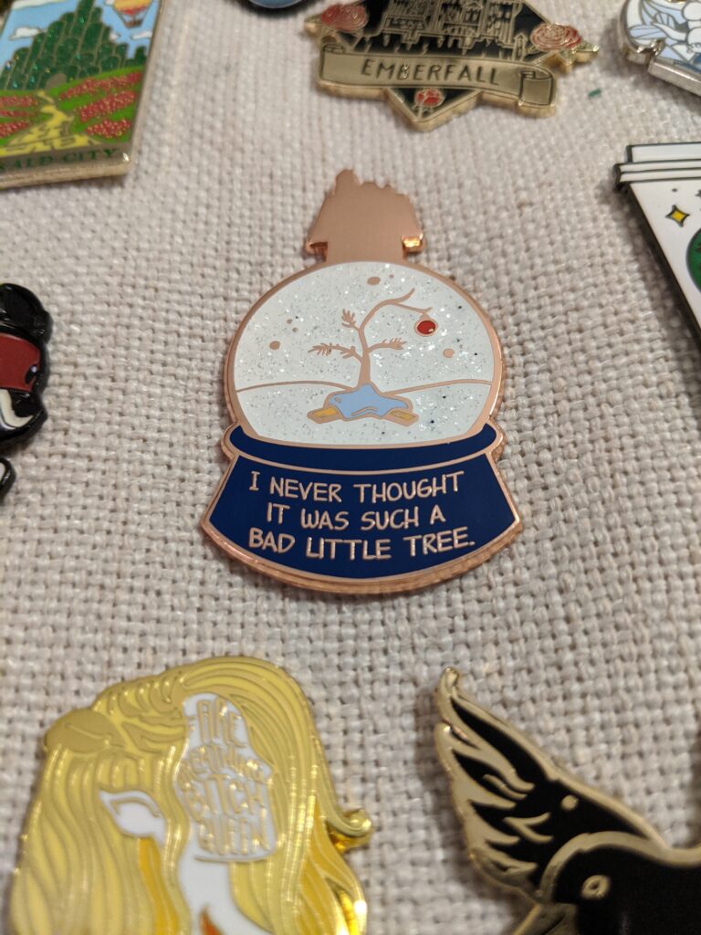 Day 15: I'm not a fan of enamel pins. I don't have any use for them. But I have to say that this Charlie Brown Christmas one is simply beautiful.